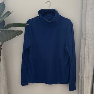 Blue ribbed turtleneck sweater